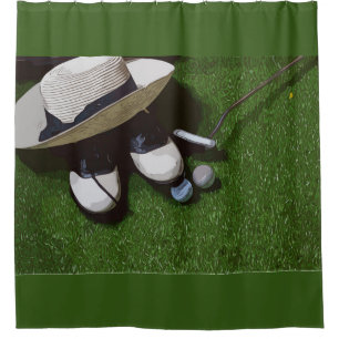 Golf balls are on green grass for golfer bathroom