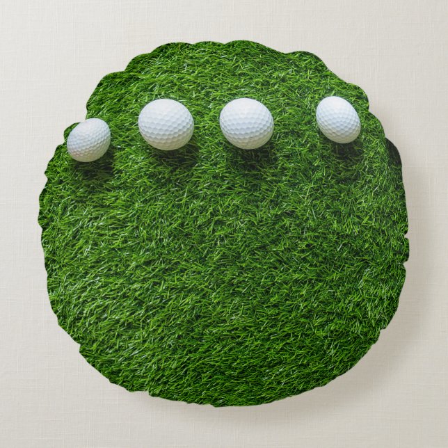 Golf Balls are on green grass Round Pillow (Front)