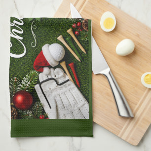 Golf Christmas themed on green grass Kitchen Towel