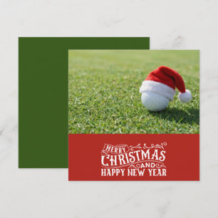 Golf Christmas themed with golf ball on green Holiday Card