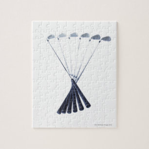 Golf clubs on white background jigsaw puzzle