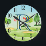 Golf Course Custom Monogram Round Clock<br><div class="desc">UNIQUE LAYERING OF THE MONOGRAM -- look closely and you will see three colours, which gives it the feeling of depth. Personalized additionally with the first name and set on a golf course. Special idea for a gift or you might just enjoy for yourself! If you have any design questions...</div>
