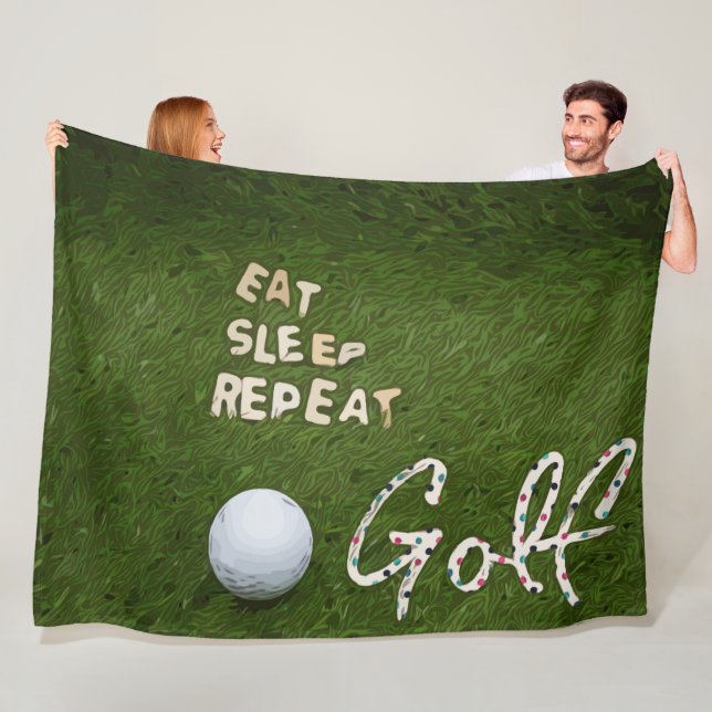 Golf eat sleep golf repeat with golf ball on green fleece blanket (In Situ)
