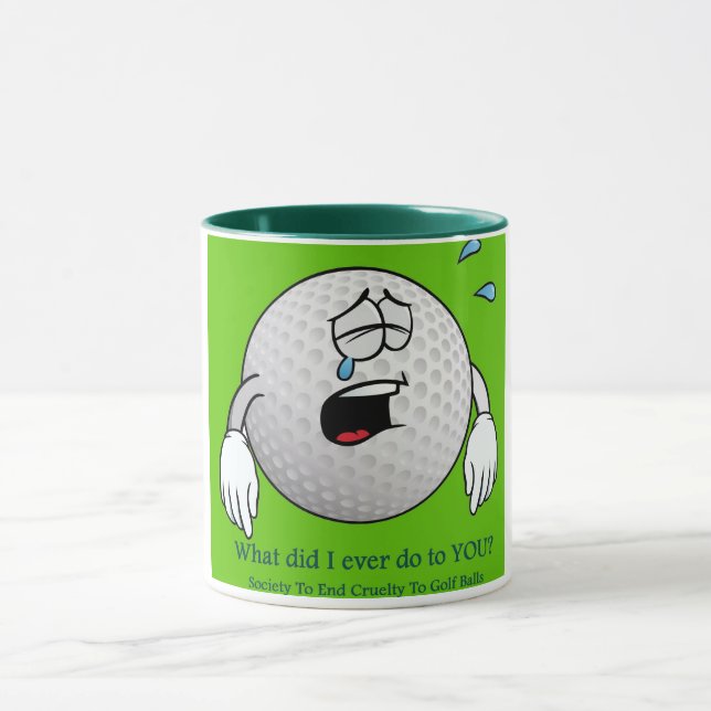 Golf Mug features golf ball with hurt feelings (Center)