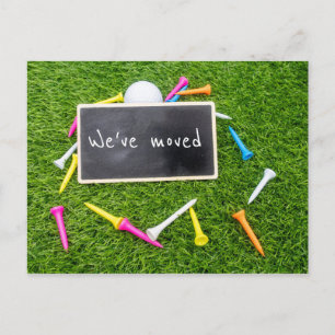 Golf we've moved to new house with colourful tees postcard