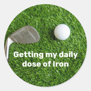 Golfer getting dose of iron and golf ball on green classic round sticker