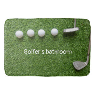 Golfer's bathroom with golf balls and putter bath mat