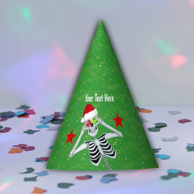 Goofy Skeleton Holding Ornaments Santa Hat Green (Cute Skeleton holding ornaments to eyes red stars on gold speckled green paper party hat.)