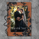 Gothic Black Raven Black Roses Rust Photo Wedding Thank You Card<br><div class="desc">Transport your guests to a world of dark, enchanting elegance with our vintage gothic wedding photo thank you card. The deep, aged burnt orange rust background sets the stage for a striking contrast for the white text. Your photo takes centre stage, surrounded by intertwining vines of black roses, which captures...</div>