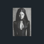 Gothic Velvet Hooded Portrait Canvas Print<br><div class="desc">A mesmerizing black-and-white portrait shows a woman with eyes softly closed beneath a deep velvet hood. Sleek dark hair parts down the center while an elaborate high-necked gothic gown with structured corset and plunging neckline accentuates her graceful form. Intricate metallic details and ornate earrings add subtle luxury against a textured...</div>