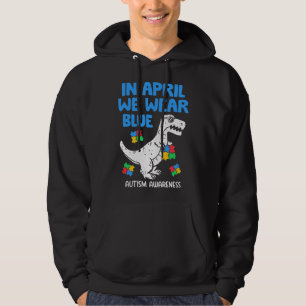 Grab this funny In April We Wear Blue Dinosaur Hol Hoodie