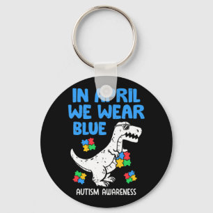 Grab this funny In April We Wear Blue Dinosaur Hol Keychain
