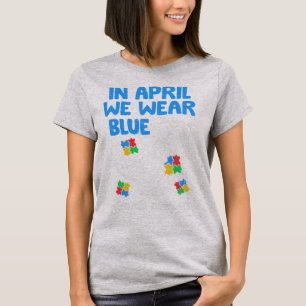Grab this funny In April We Wear Blue Dinosaur Hol T-Shirt