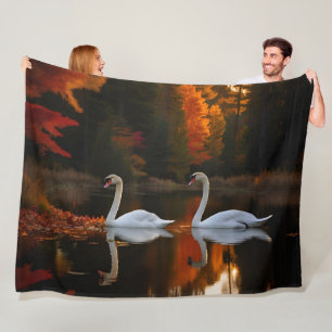 Graceful White Swans Gliding Across Autumn Pond Fleece Blanket