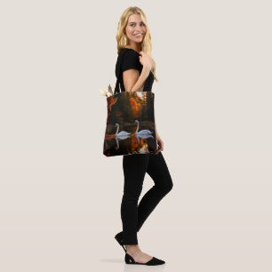 Graceful White Swans Gliding Across Autumn Pond Tote Bag