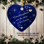 Granddaughter Star Heart Keepsake Ceramic Ornament<br><div class="desc">This is a wonderful Christmas ornament for a grandparent to give to a granddaughter. It features silver snowflake, heart and star images against a deep blue gradient background. In the centre is your customized text in white. Currently, the text says "Granddaughters are the stars in our hearts". The text is...</div>