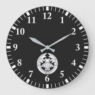 Grande Horloge Ronde Bambou coupé dans des feuilles de bambou étreignan
