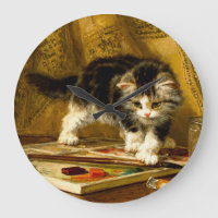 Kitten avec peinture et brosses