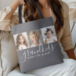 Grandkids Make Life Grand 3 Photo Collage Grey Tote Bag<br><div class="desc">A thoughtful gift for grandparents, this stylish personalized tote bag design features a 3-photo template to personalize with photos of the grandchildren. A combination of modern handwritten script combined with a modern sans serif font spell out "grandkids make life grand!" The background is a trendy grey that is always in...</div>