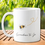 Grandma To Bee Coffee Mug<br><div class="desc">This coffee mug is decorated with watercolor honey bees and "Grandma to Bee" in stylish script typography.
Easily customizable with your monogram. Makes a lovely gift for the expectant mother.
Original Watercolor © Michele Davies.</div>