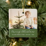 Grandparents Calligraphy Merry Christmas Photo Ceramic Ornament<br><div class="desc">Modern elegant minimal holiday ornament features one large of your favourite photo,  white script calligraphy "Merry Christmas" with classic serif lettering overlaying on festive pine green block.</div>