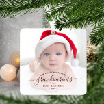 Grandparents First Christmas Photo Red Script Metal Ornament<br><div class="desc">Help them celebrate their first grandchild with this beautiful modern keepsake ornament. The burgundy red text reads "Our first Christmas as grandparents, " with the word "grandparents" in elegant handwriting script with flourishes before and after. Easily replace the sample image with your favorite photo of the new baby, and add...</div>