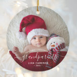 Grandparents First Christmas Photo White Script Ceramic Ornament<br><div class="desc">Help them celebrate their first grandchild with this beautiful modern keepsake ornament. The white text reads "Our first Christmas as grandparents, " with the word "grandparents" in elegant handwriting script with flourishes before and after. Easily replace the sample image with your favourite photo of the new baby, and add his...</div>