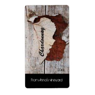 grape leaf on wooden board wine bottle label