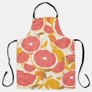 Grapefruit and halved slices with leaves on white. apron