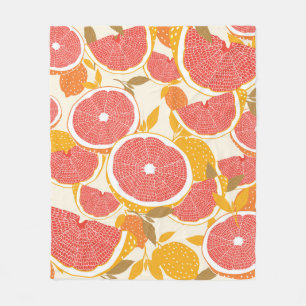 Grapefruit and halved slices with leaves on white. fleece blanket