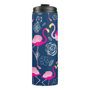 Graphic pattern of pink flamingos on a dark blue b thermal tumbler