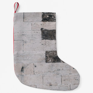 Gray cement wall small christmas stocking