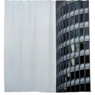GRAY CONCRETE BUILDING UNDER WHITE SKY DURING DAYT