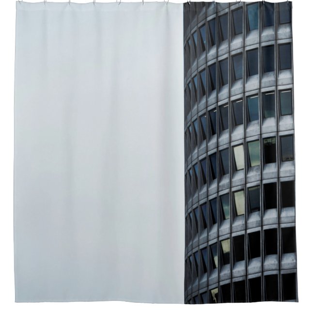 GRAY CONCRETE BUILDING UNDER WHITE SKY DURING DAYT (Front)