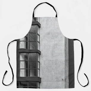 GRAY CONCRETE BUILDING WITH GLASS WINDOW APRON