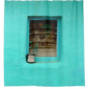 GRAY STEEL CONTAINER ON WINDOW WITH TEAL PAINT