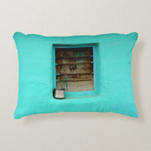 GRAY STEEL CONTAINER ON WINDOW WITH TEAL PAINT ACCENT PILLOW