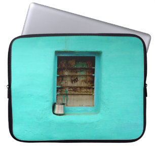 GRAY STEEL CONTAINER ON WINDOW WITH TEAL PAINT LAPTOP SLEEVE