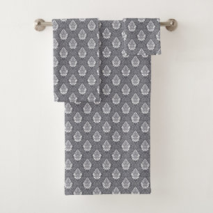 Gray towels with ornate, white paisley patterns 