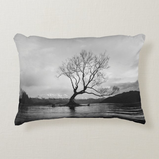 GRAYSCALE PHOTO OF BARE TREE ON CALM BODY OF WATER ACCENT PILLOW (Front)
