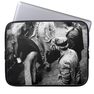 GRAYSCALE PHOTO OF MEN STANDING BESIDE 60163 TRAIN LAPTOP SLEEVE