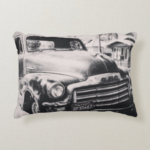 GRAYSCALE PHOTOGRAPHY OF CAR ACCENT PILLOW