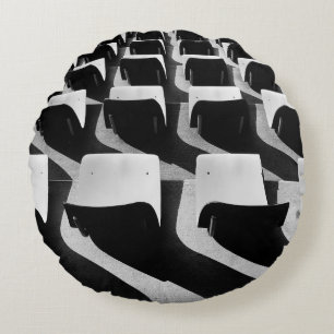 Grayscale photography of chairs with no people round pillow