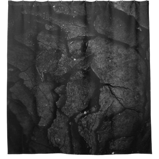 Grayscale photography of rock formation (Front)