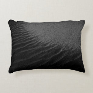 Grayscale photography of sand accent pillow