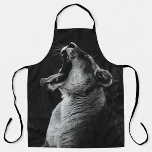 GRAYSCALE PHOTOGRAPHY OF YAWNING LIONESS APRON