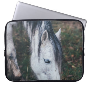 GRAZING GRAY HORSE ON AN AUTUMN’S DAY LAPTOP SLEEVE