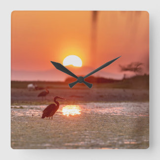 Great Heron Feeding At Sunset Square Wall Clock