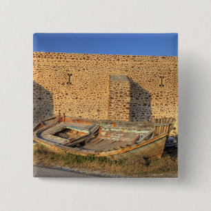 Greece, Santorini, Oia. Old fishing boat on dry 2 Inch Square Button