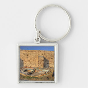 Greece, Santorini, Oia. Old fishing boat on dry Keychain
